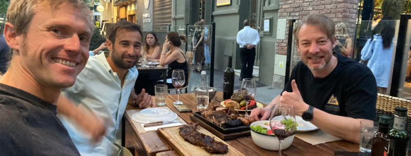 Our climber, TJ, enjoying dinner in Mendoza with our guides, Terray and Laucha.