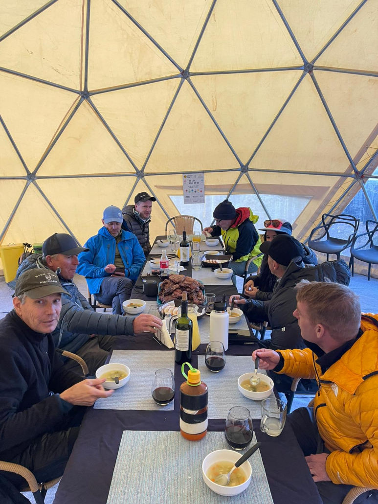 The team sitting down for a well-deserved meal in Confluencia Camp.