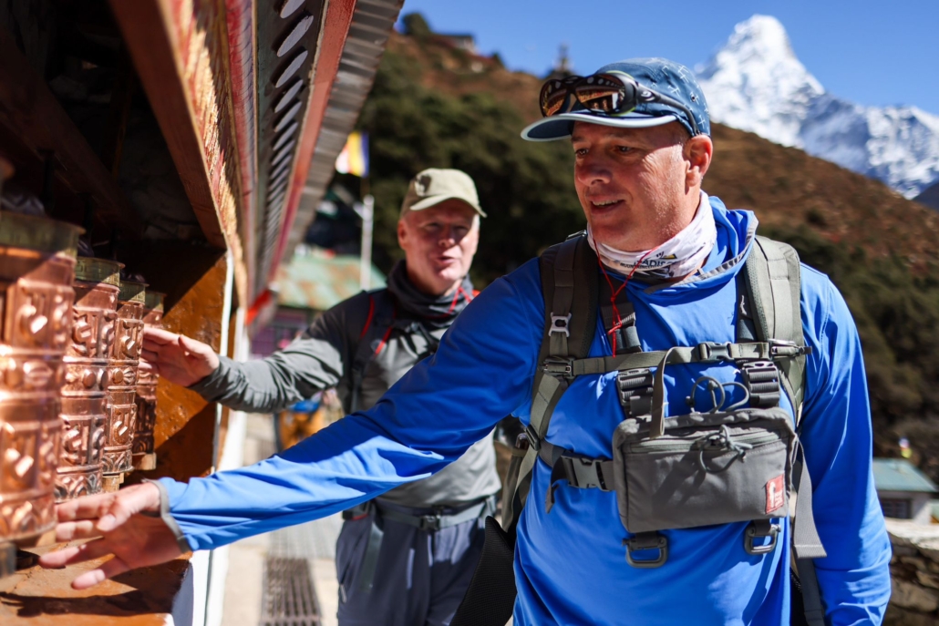 Our guest, Erik, spinning prayer wheels at the monastery. (Photo by Terray Sylvester)