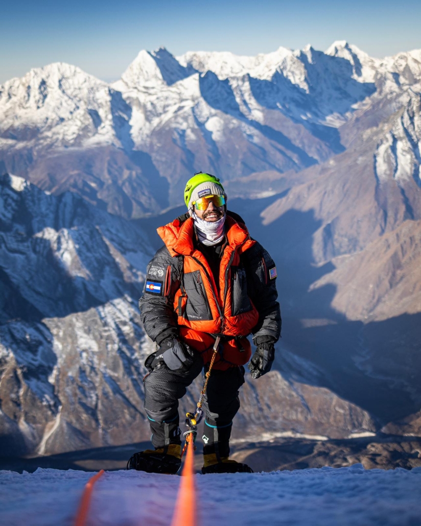 Our climber, Joe, stepping onto the summit! (Photo by Terray Sylvester)